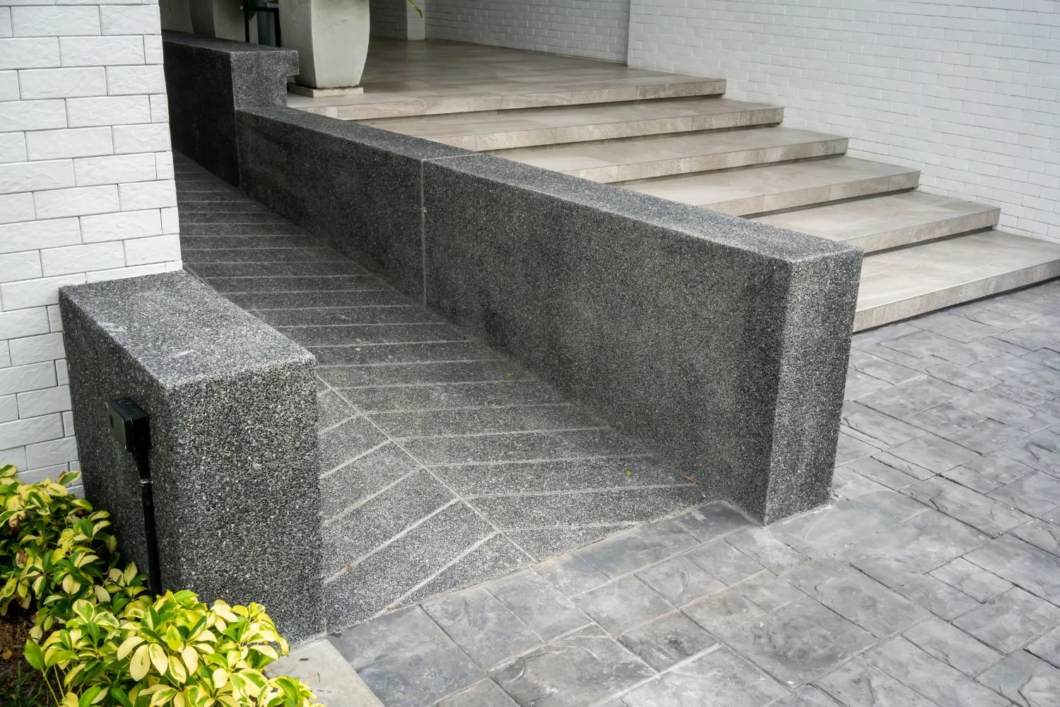 Concrete ramp built to manage a sloped Bradbury block